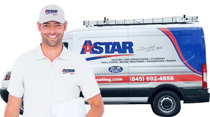 Smiling worker in Astar uniform holding paperwork, standing in front of an Astar branded service van.